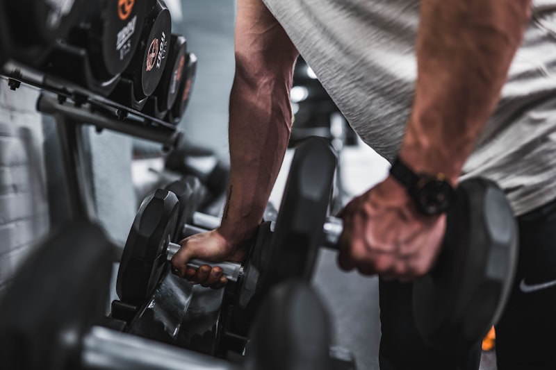 Bodybuilding muscle gain training with weights in professional gym setting